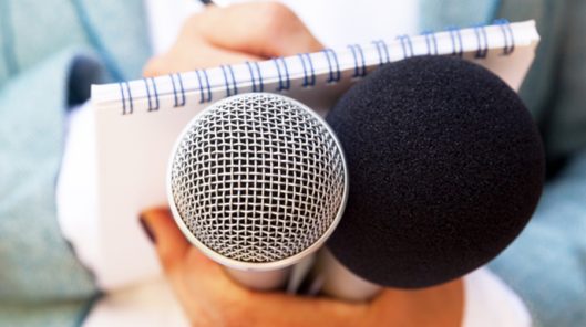 Reporter with Microphone