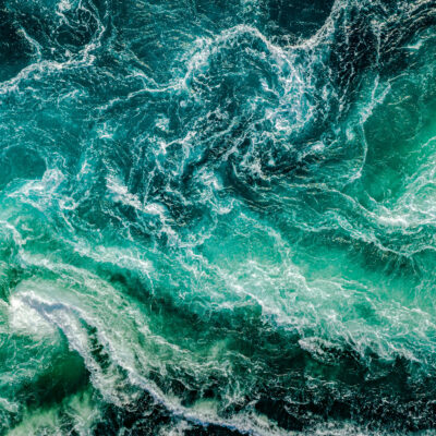 Waves Of Water Of The River And The Sea Meet Each Other During High Tide And Low Tide.