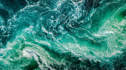 Waves Of Water Of The River And The Sea Meet Each Other During High Tide And Low Tide.